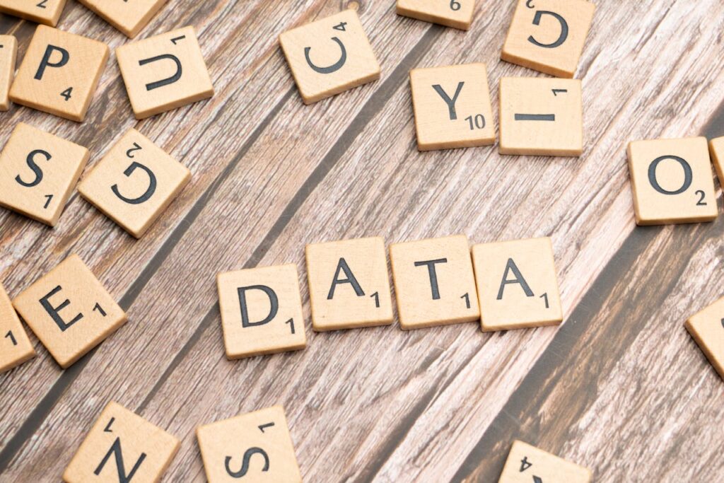 pexels photo 19891028 Wooden letter tiles spelling 'DATA' on a wood textured surface, symbolizing data concepts.